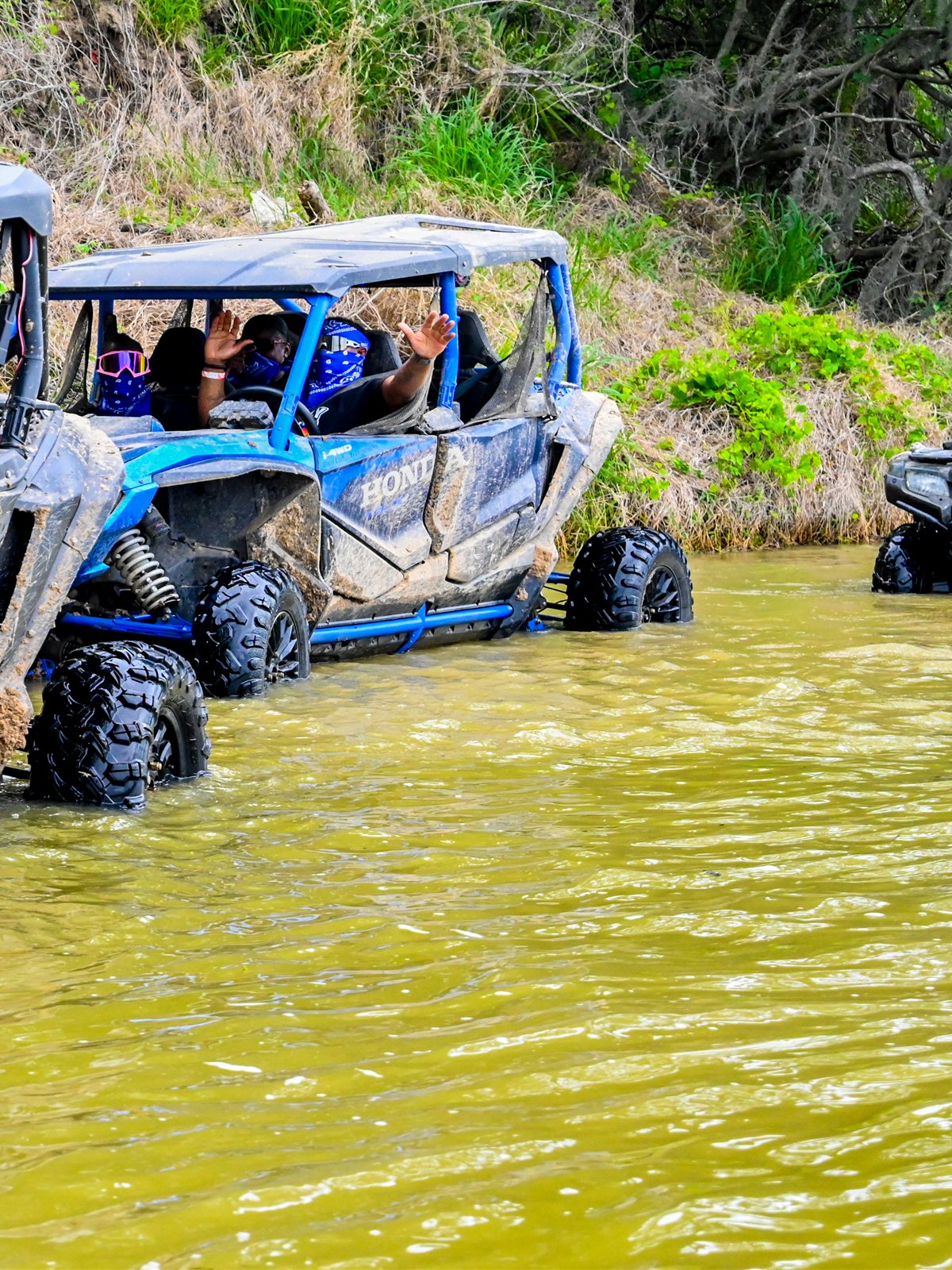 Four-seat Honda Talon Side-by-Side carrying a group through the trails at Xtreme Off Road Park