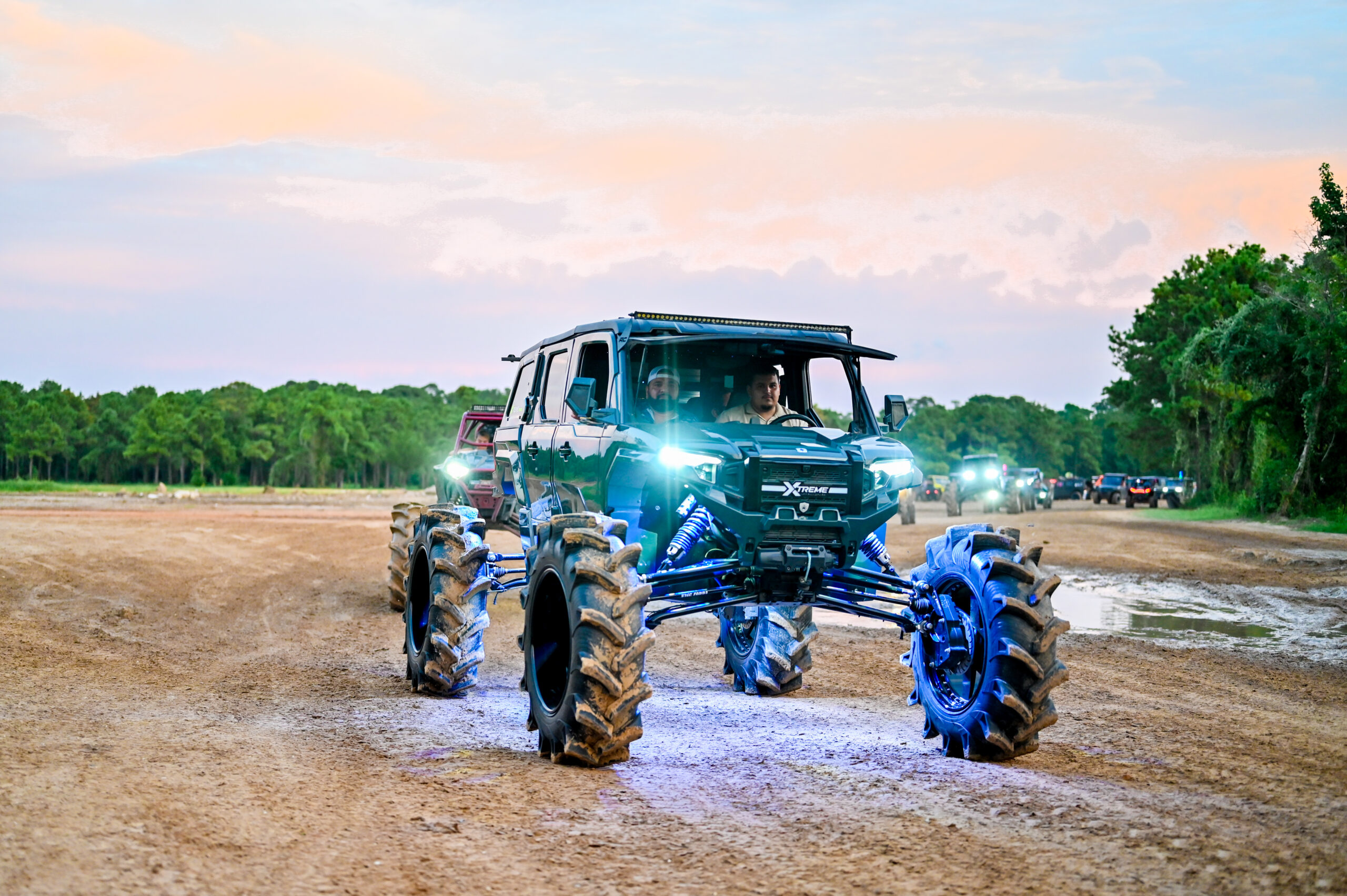 Lifted side-by-side rolling across the trails at Xtreme Unlimited Routes